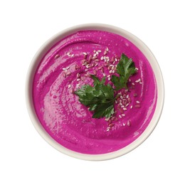 Photo of Tasty beetroot hummus, parsley and sesame in bowl isolated on white, top view