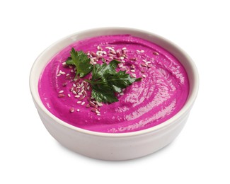 Photo of Tasty beetroot hummus, parsley and sesame in bowl isolated on white