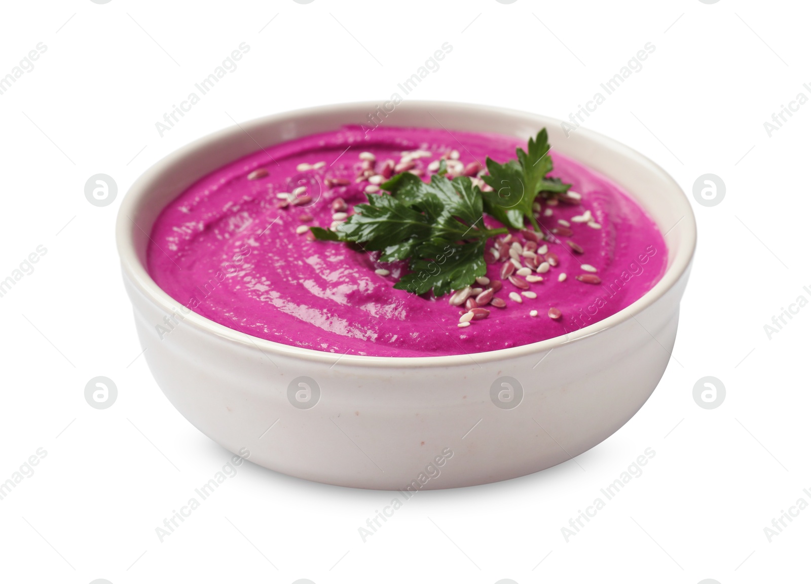 Photo of Tasty beetroot hummus, parsley and sesame in bowl isolated on white