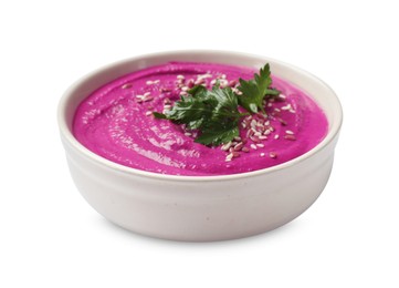 Photo of Tasty beetroot hummus, parsley and sesame in bowl isolated on white