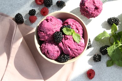 Photo of Delicious blackberry sorbet, mint and fresh berries on grey table, flat lay