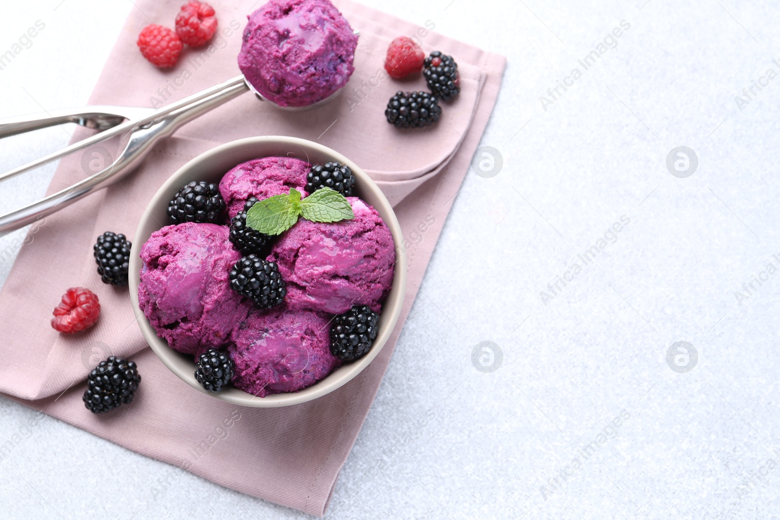 Photo of Delicious blackberry sorbet, mint and fresh berries on grey table, flat lay, space for text