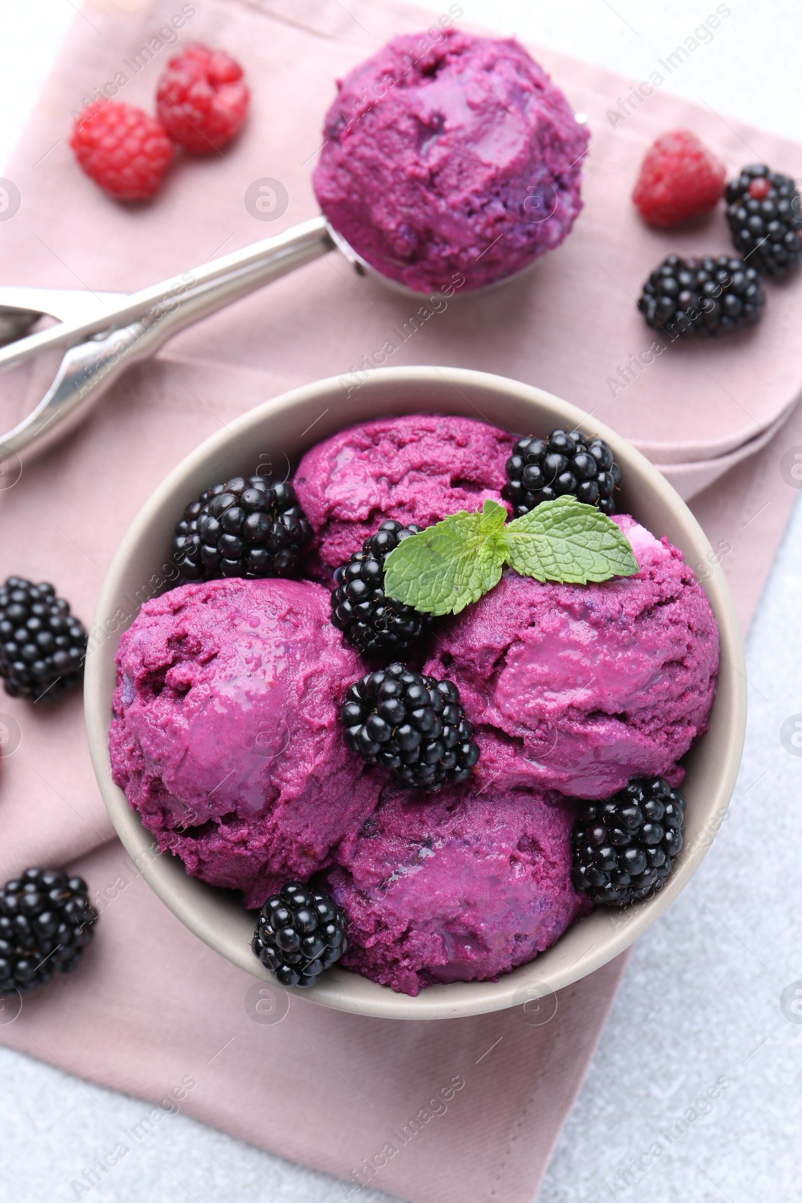 Photo of Delicious blackberry sorbet, mint and fresh berries on grey table, flat lay