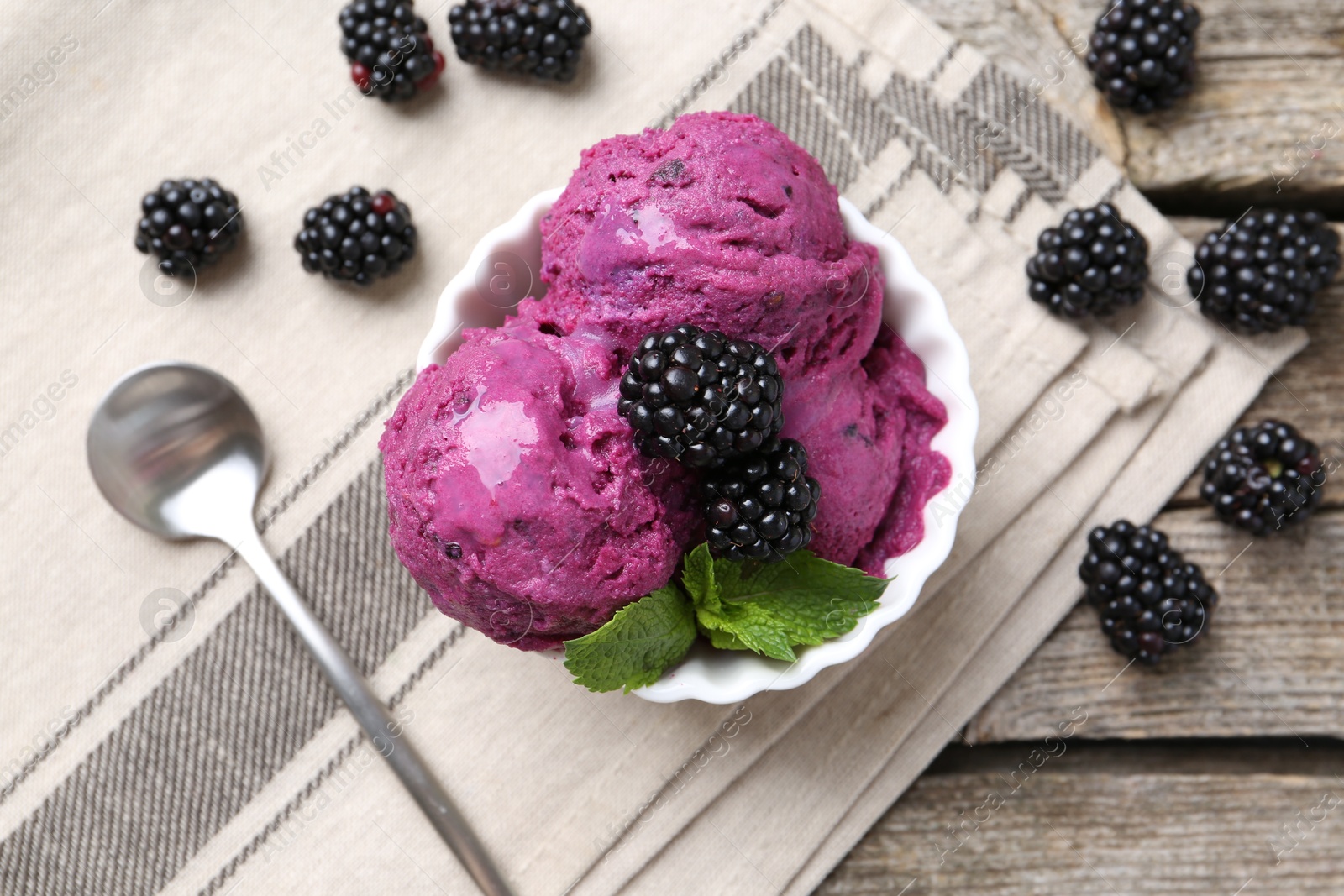 Photo of Delicious blackberry sorbet, mint and fresh berries on wooden table, top view