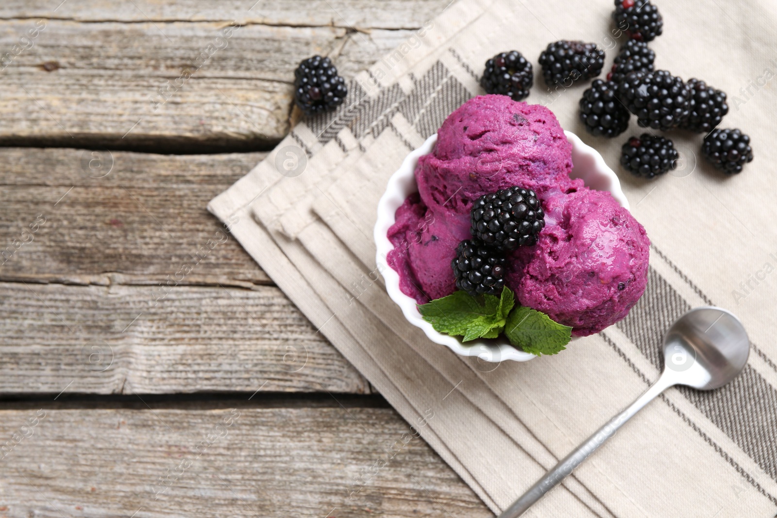 Photo of Delicious blackberry sorbet, mint and fresh berries on wooden table, top view. Space for text