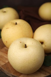 Photo of Delicious fresh apple pears on table, closeup