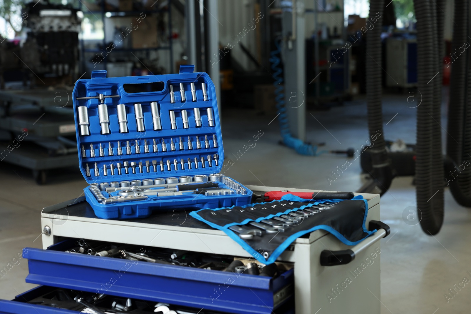 Photo of Different auto mechanic's tools at automobile repair shop