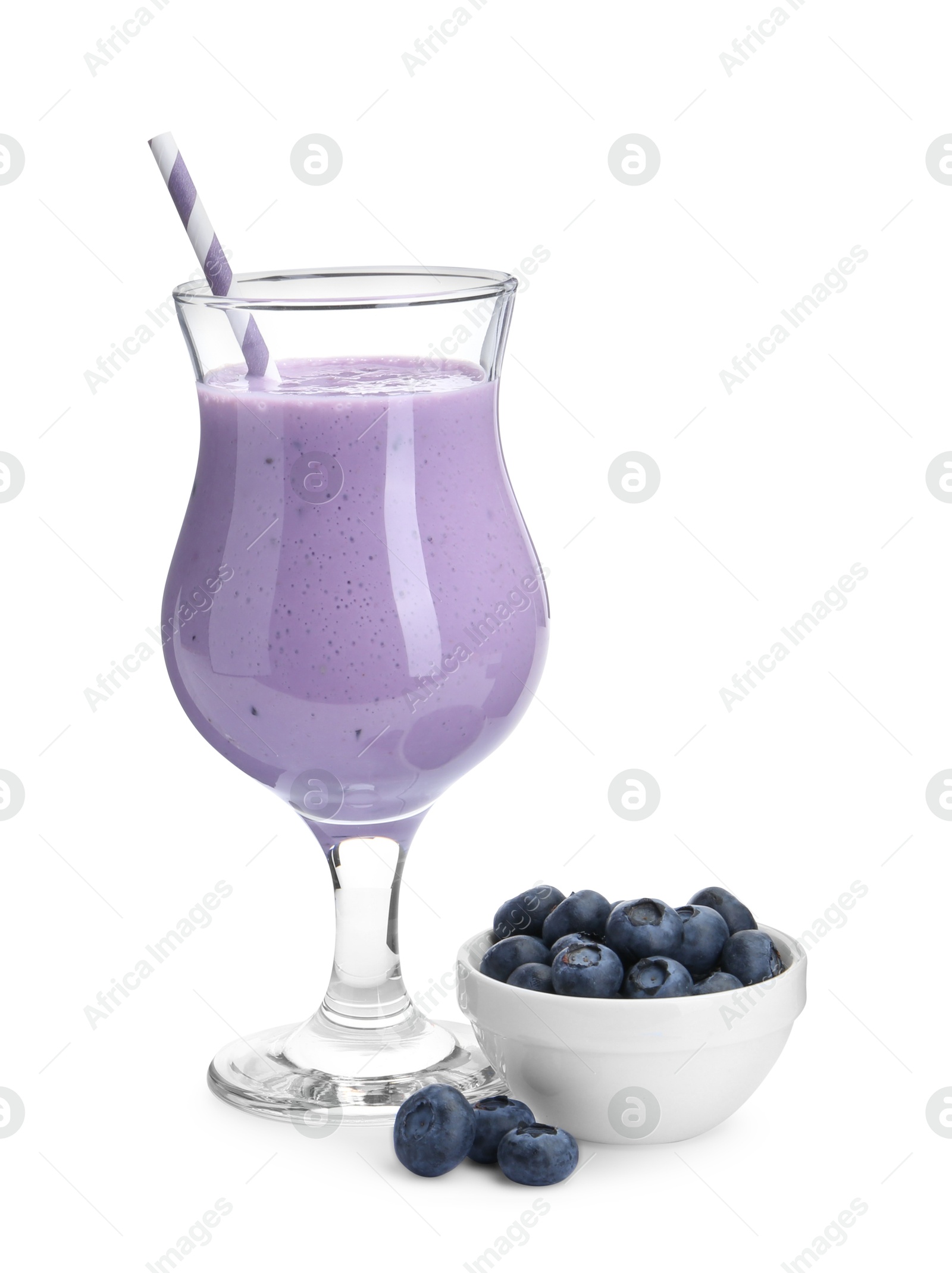 Photo of Tasty yogurt in glass and fresh blueberries isolated on white