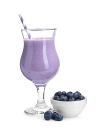 Tasty yogurt in glass and fresh blueberries isolated on white