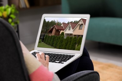 Image of Man looking for house on real estate market website at home, closeup