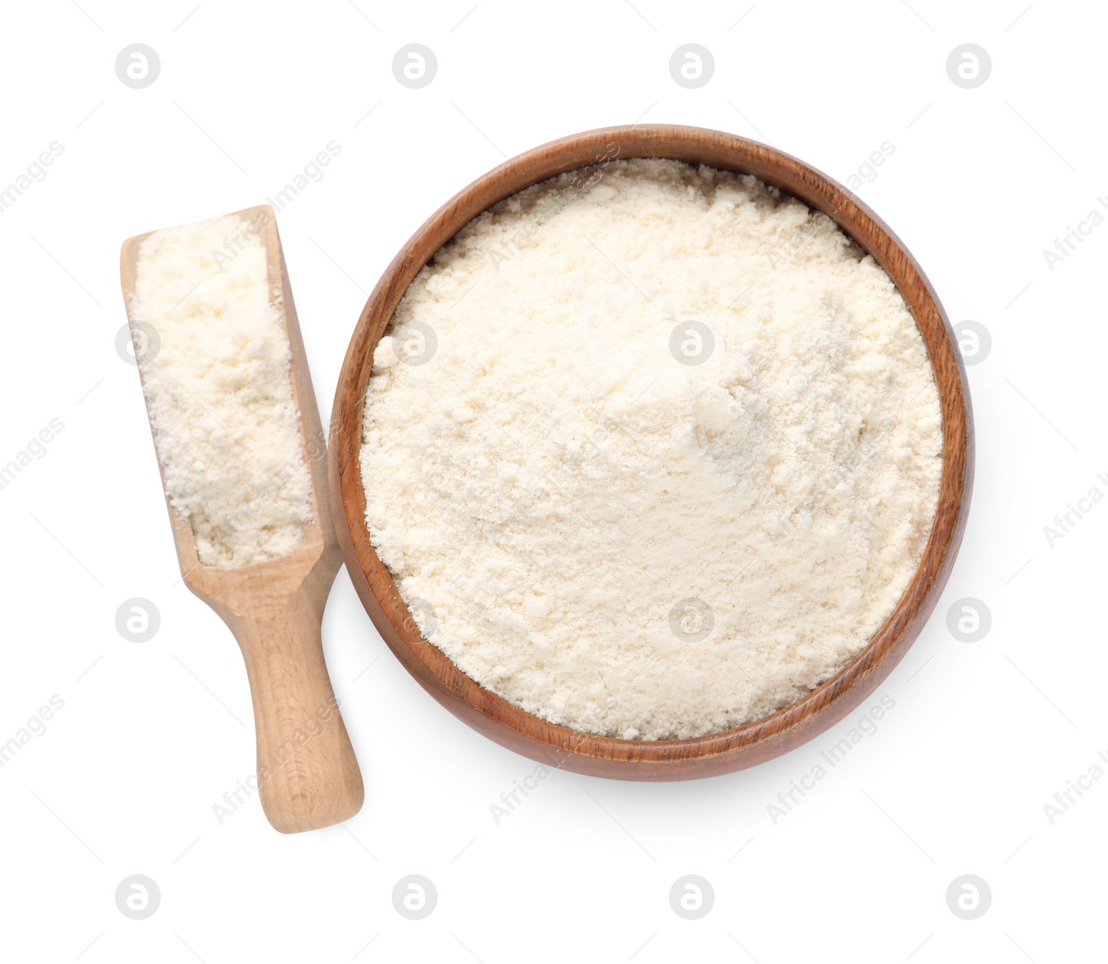 Photo of Fresh coconut flour in bowl and scoop isolated on white, top view