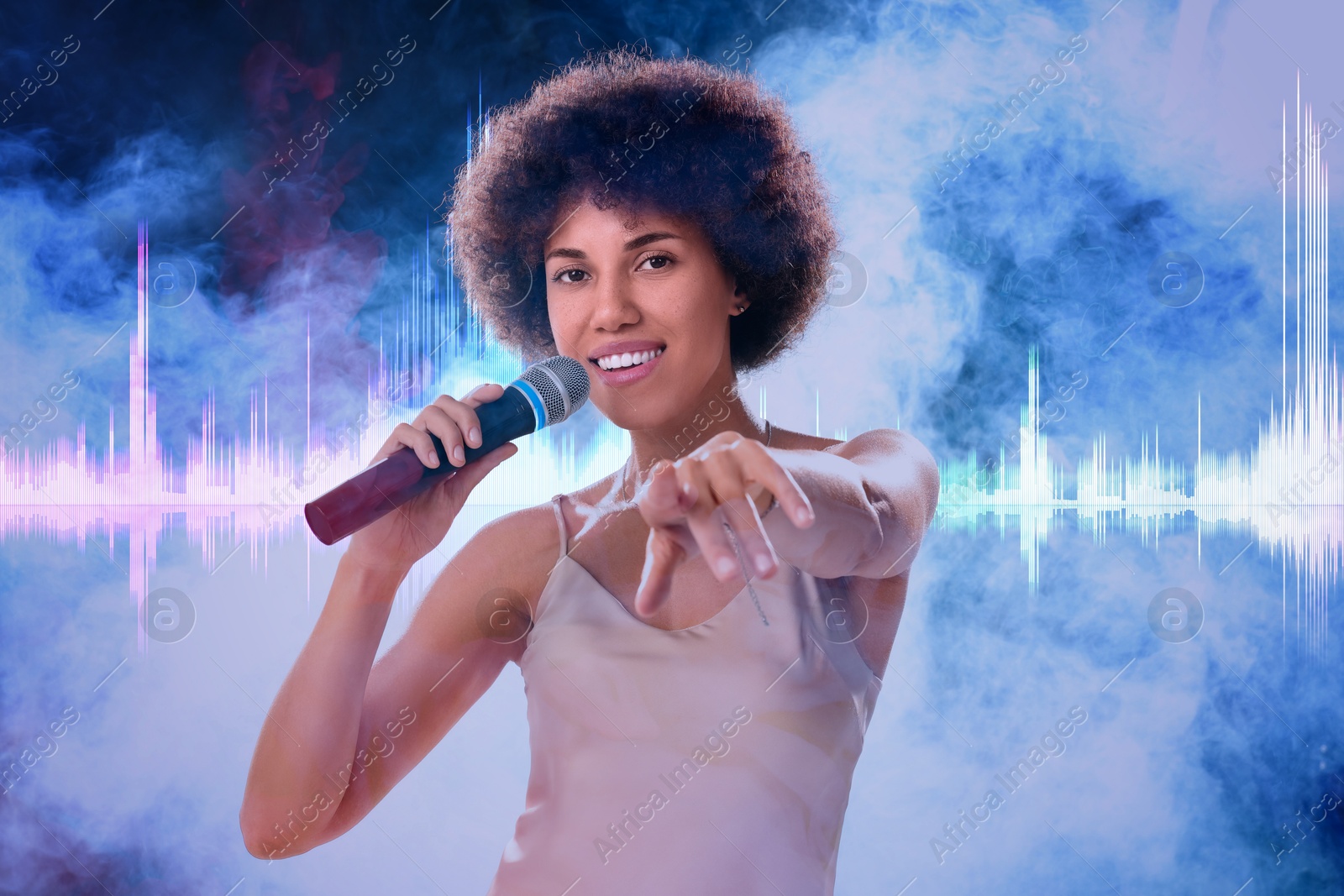 Image of Curly young woman with microphone singing in smoke. Audio waveform near her