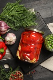 Photo of Different pickled products in jars and fresh ingredients on grey wooden table, top view