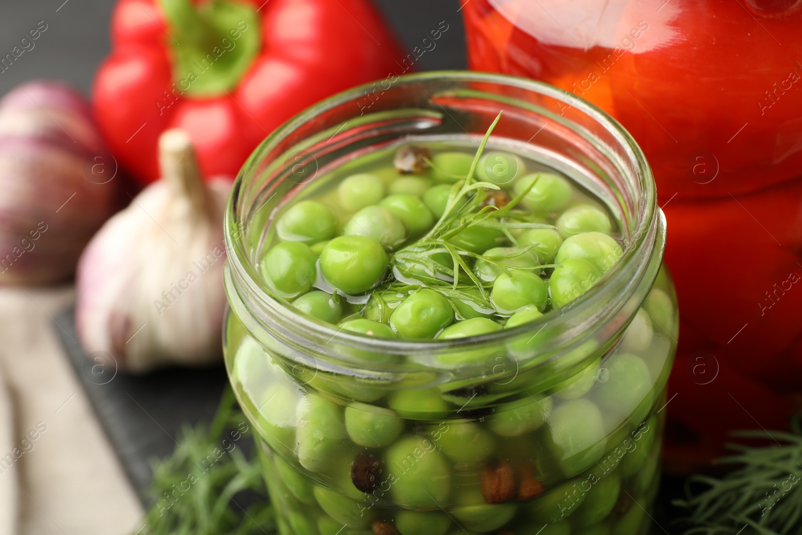 Photo of Tasty pickled green peas on table, closeup