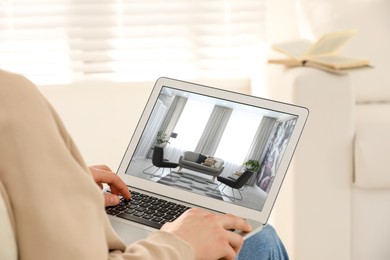 Image of Man looking for house on real estate market website at home, closeup