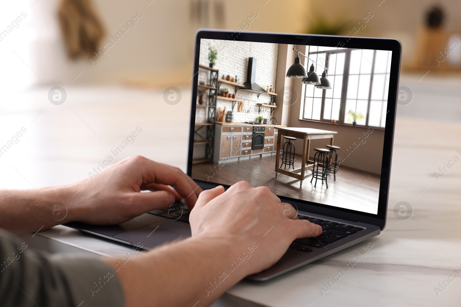 Image of Man looking for house on real estate market website at table, closeup