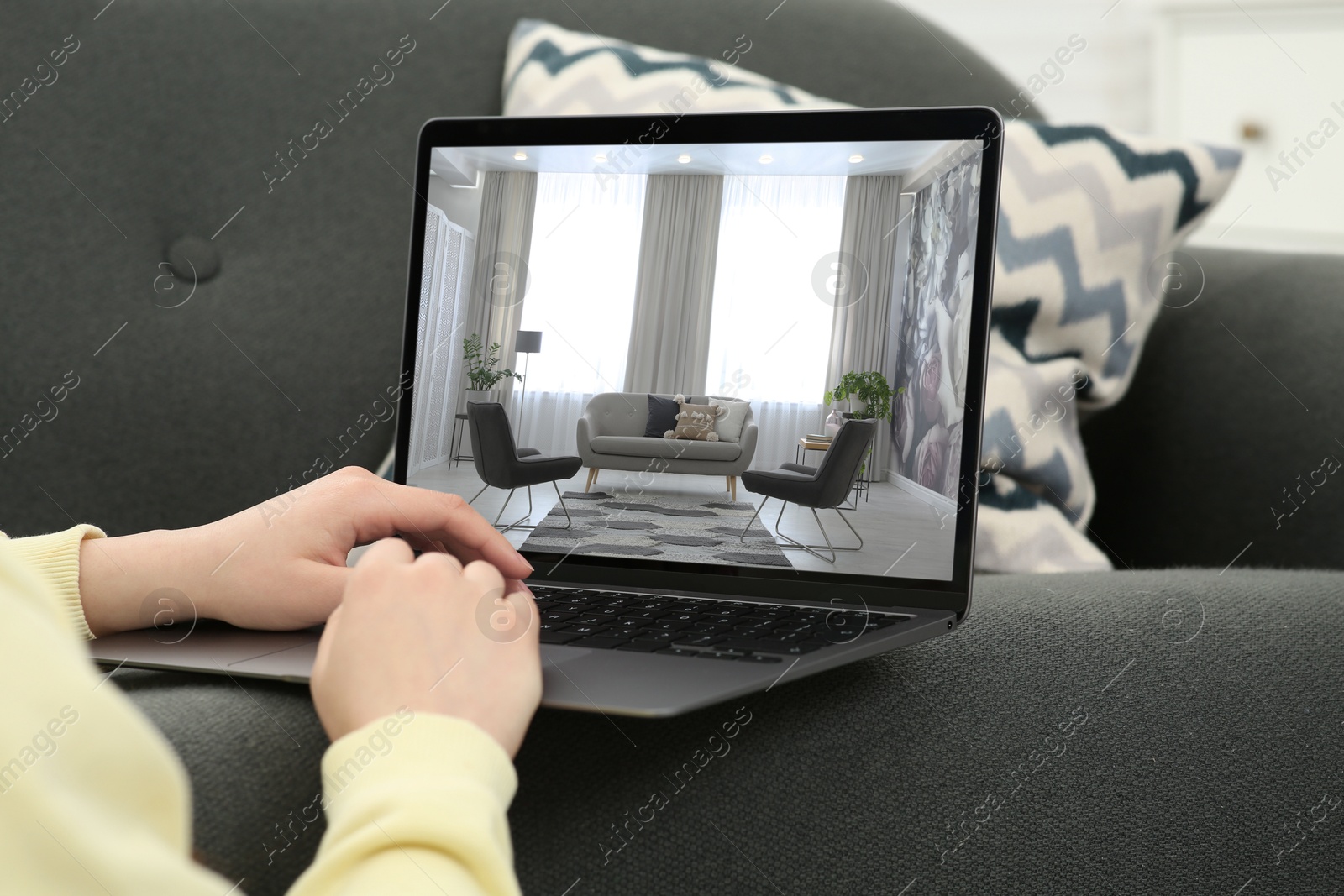 Image of Woman looking for house on real estate market website at home, closeup