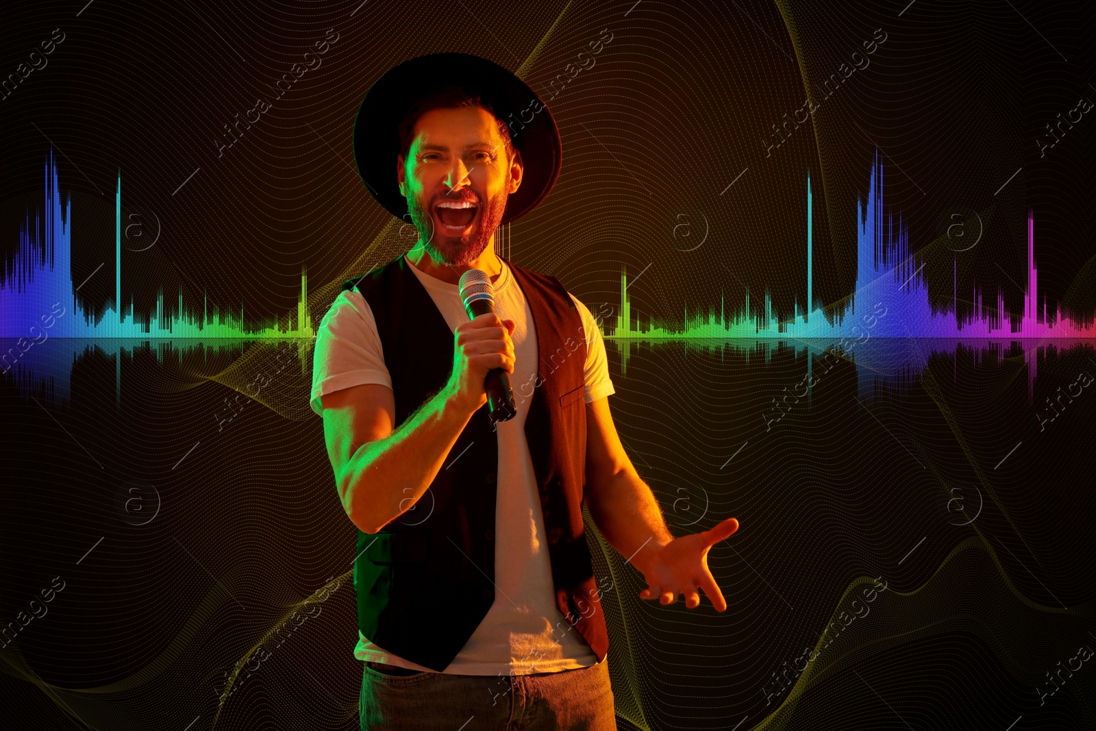 Image of Handsome man with microphone singing in neon lights on dark background. Audio waveform near him