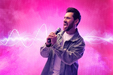 Image of Handsome man with microphone singing on pink background. Audio waveform near him