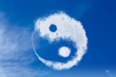 Image of Yin and yang symbol made of clouds in sky