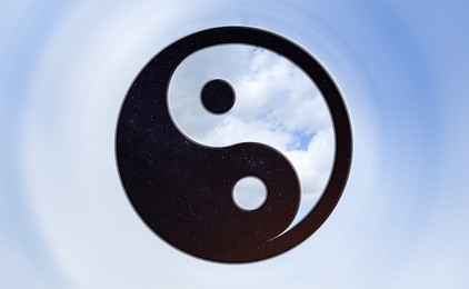 Image of Yin and yang symbol with sky at night and day inside