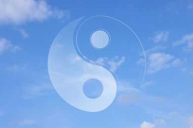 Image of Yin and yang symbol against sky, double exposure