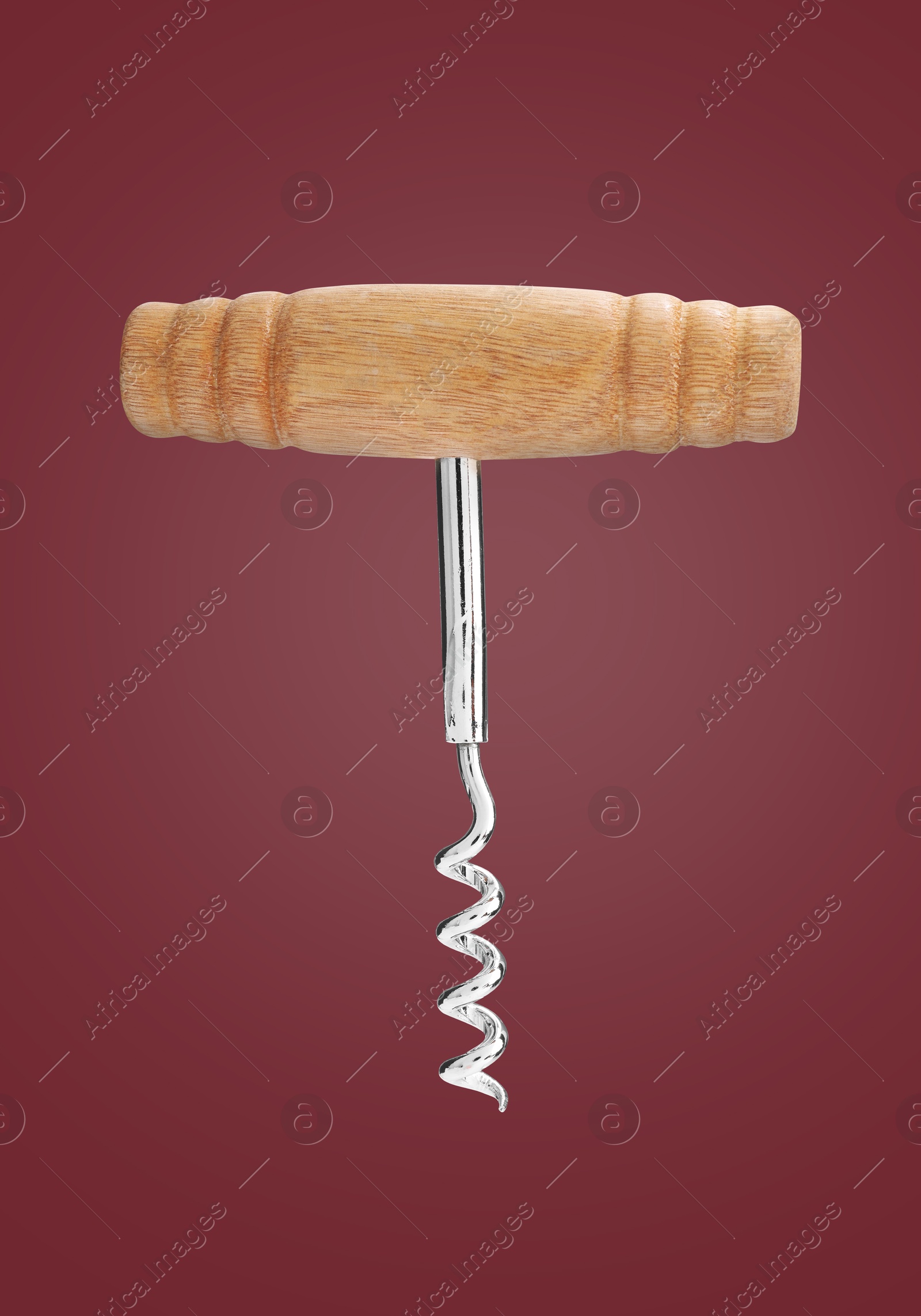 Image of Corkscrew with wooden handle on red background