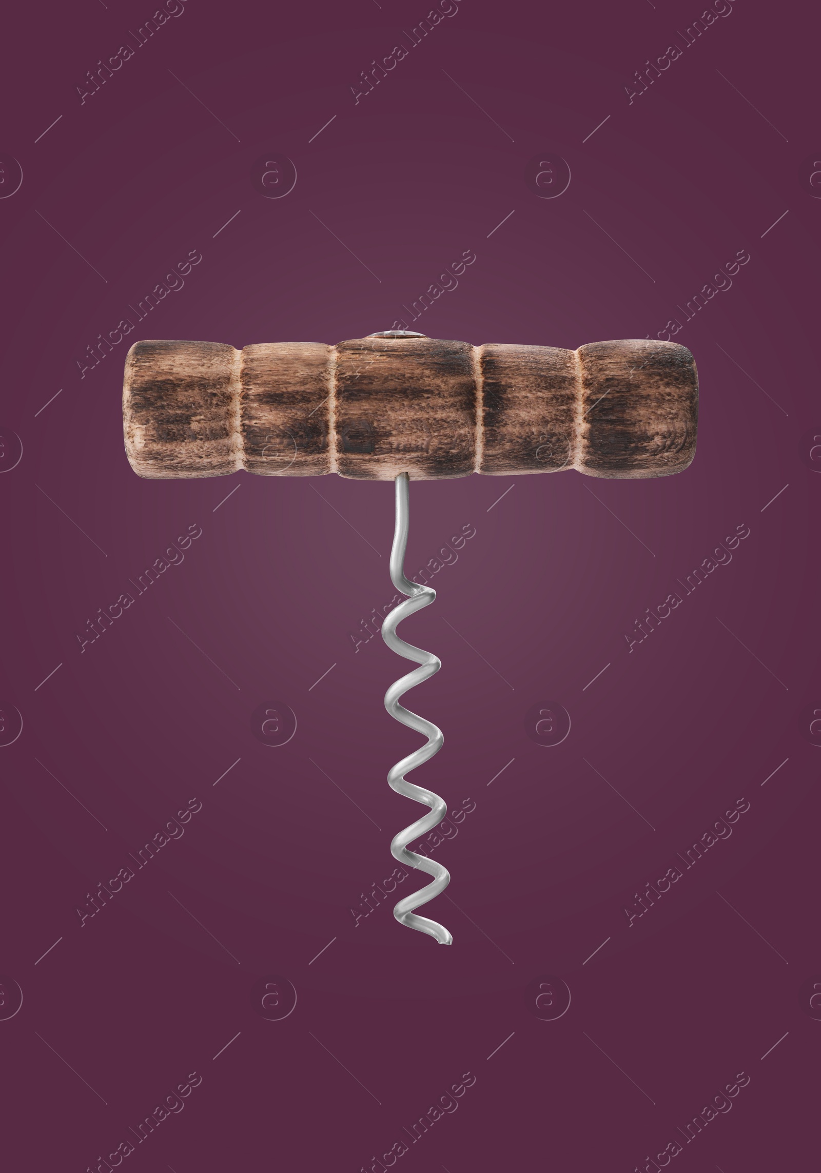 Image of Corkscrew with wooden handle on dark purple background