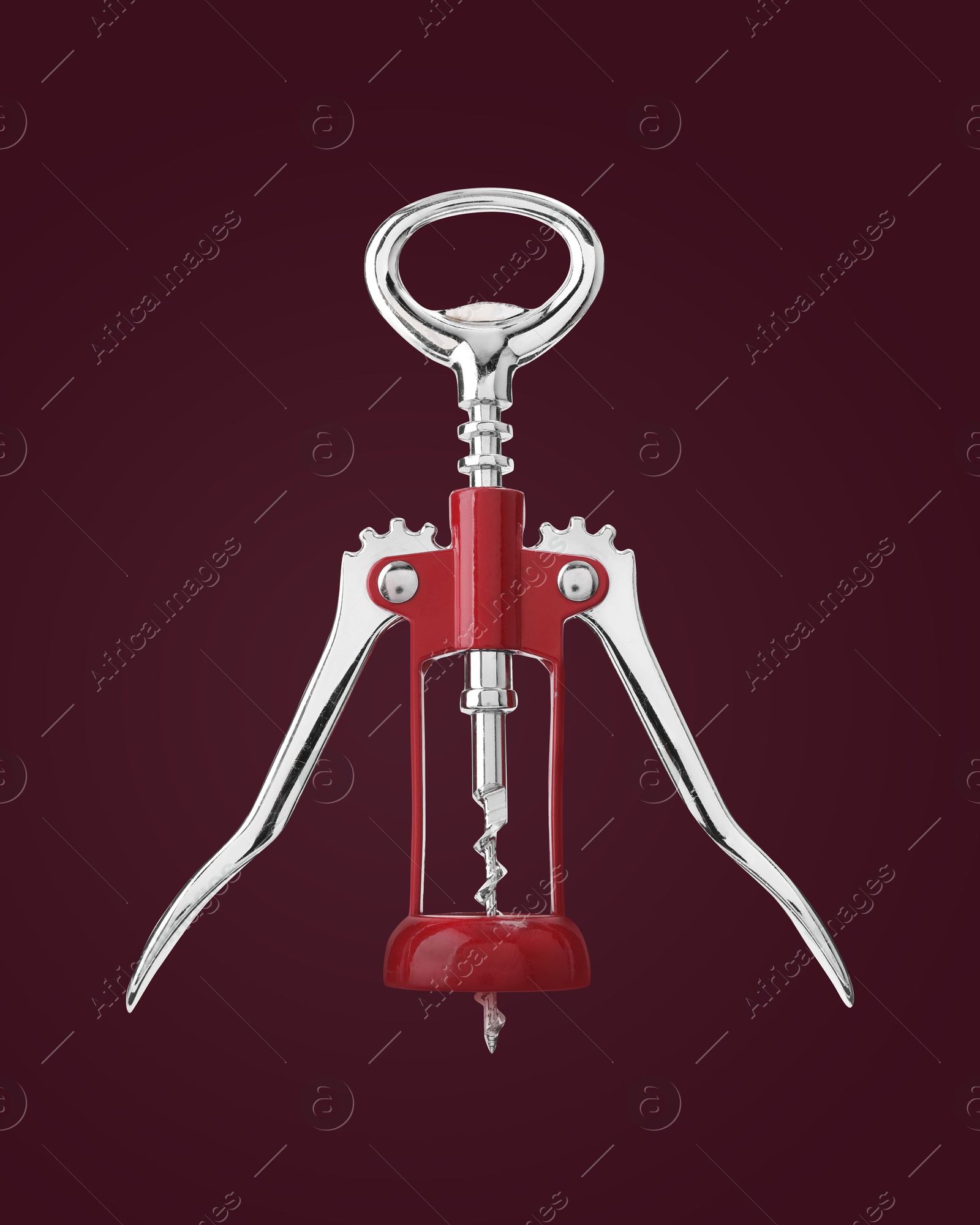 Image of Winged corkscrew on with rack and pinion mechanism on dark purplish red background