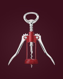 Image of Winged corkscrew on with rack and pinion mechanism on dark purplish red background