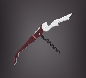 Sommelier knife with corkscrew dark grey gradient background