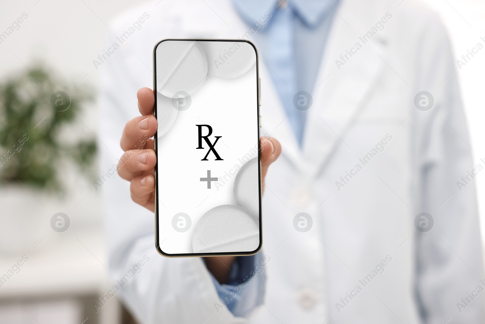 Image of Medical prescription. Doctor showing smartphone in clinic, closeup