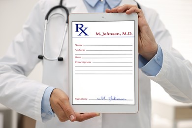 Image of Doctor showing medical prescription on tablet display in clinic, closeup