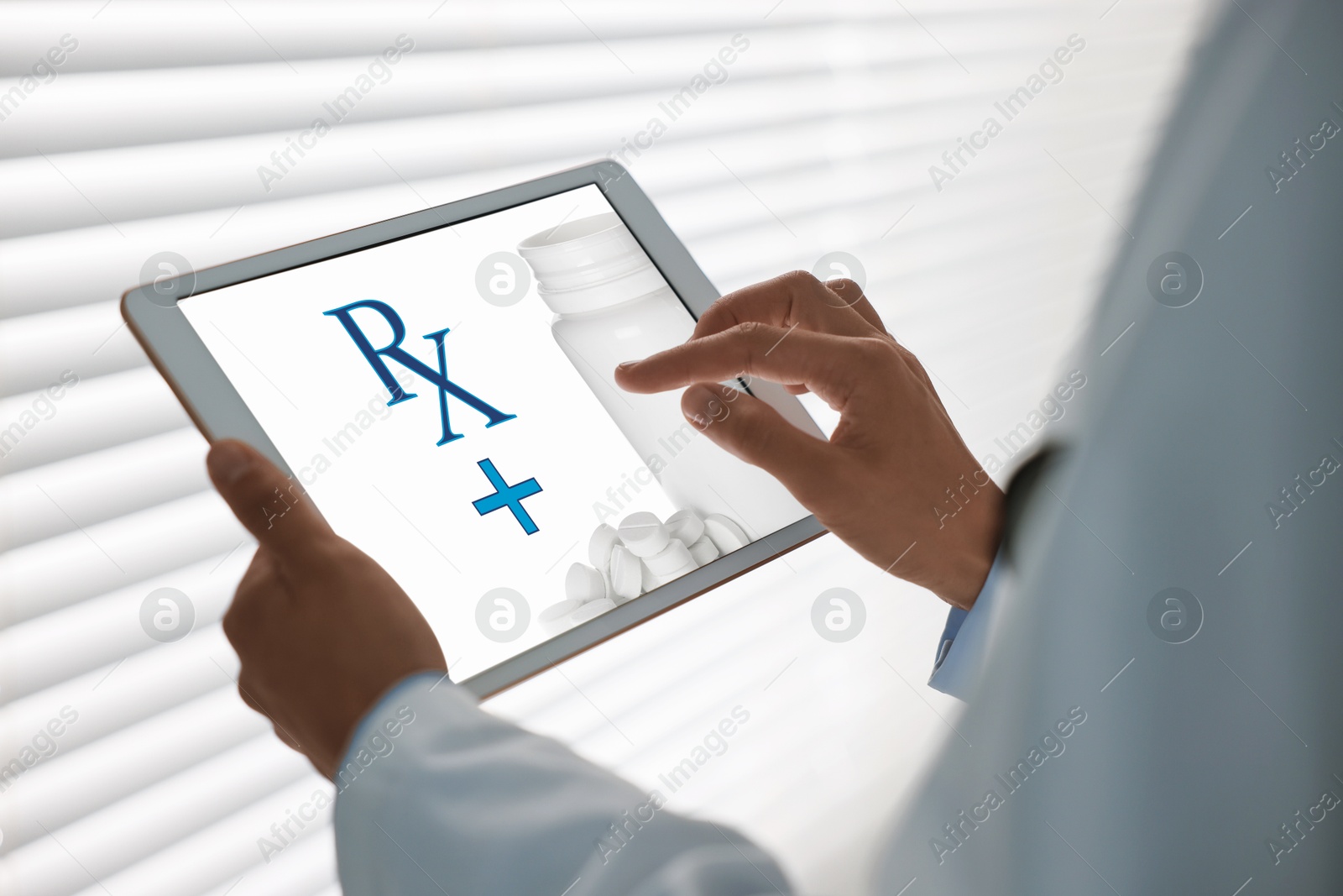 Image of Medical prescription. Doctor working on tablet in clinic, closeup