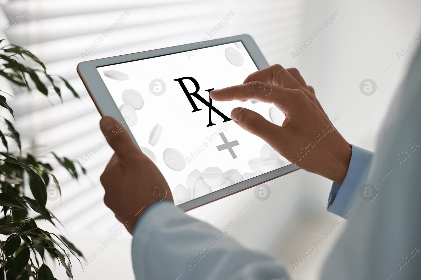 Image of Medical prescription. Doctor working on tablet in clinic, closeup