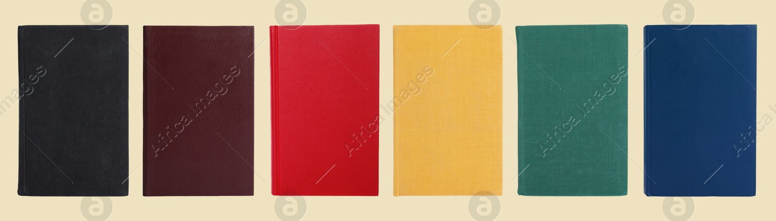 Image of Many books with colorful hardcovers on beige background, set