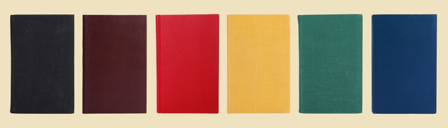 Image of Many books with colorful hardcovers on beige background, set