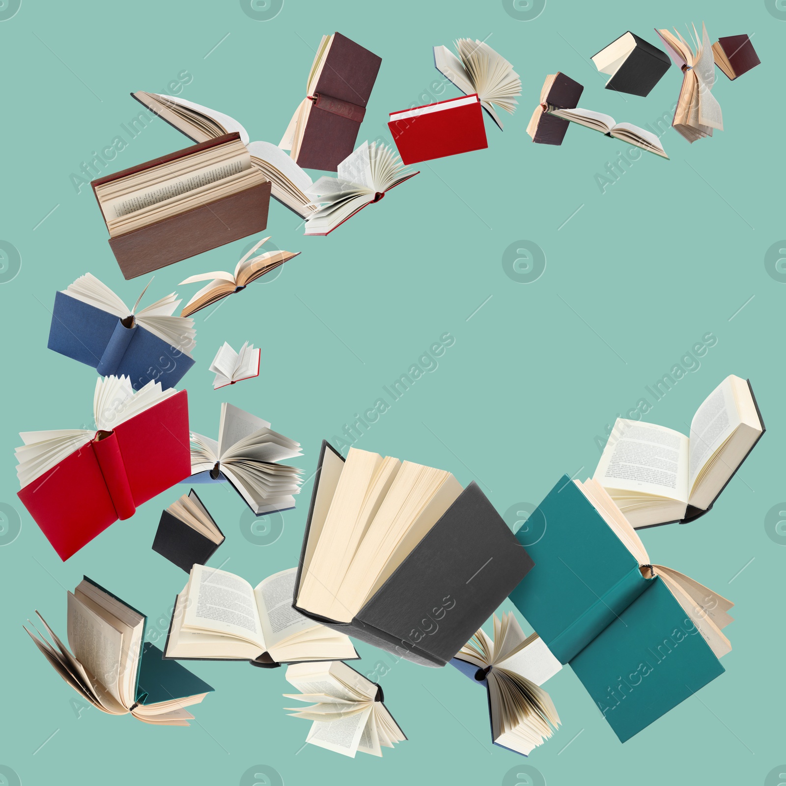 Image of Many different books in air on turquoise background