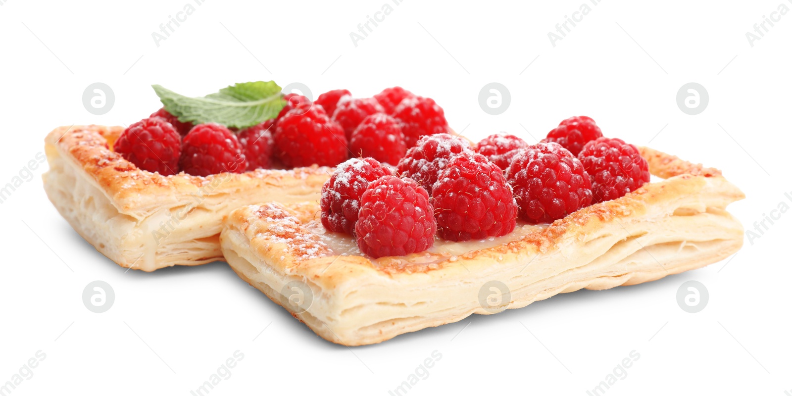 Photo of Tasty puff pastries with raspberries and mint isolated on white