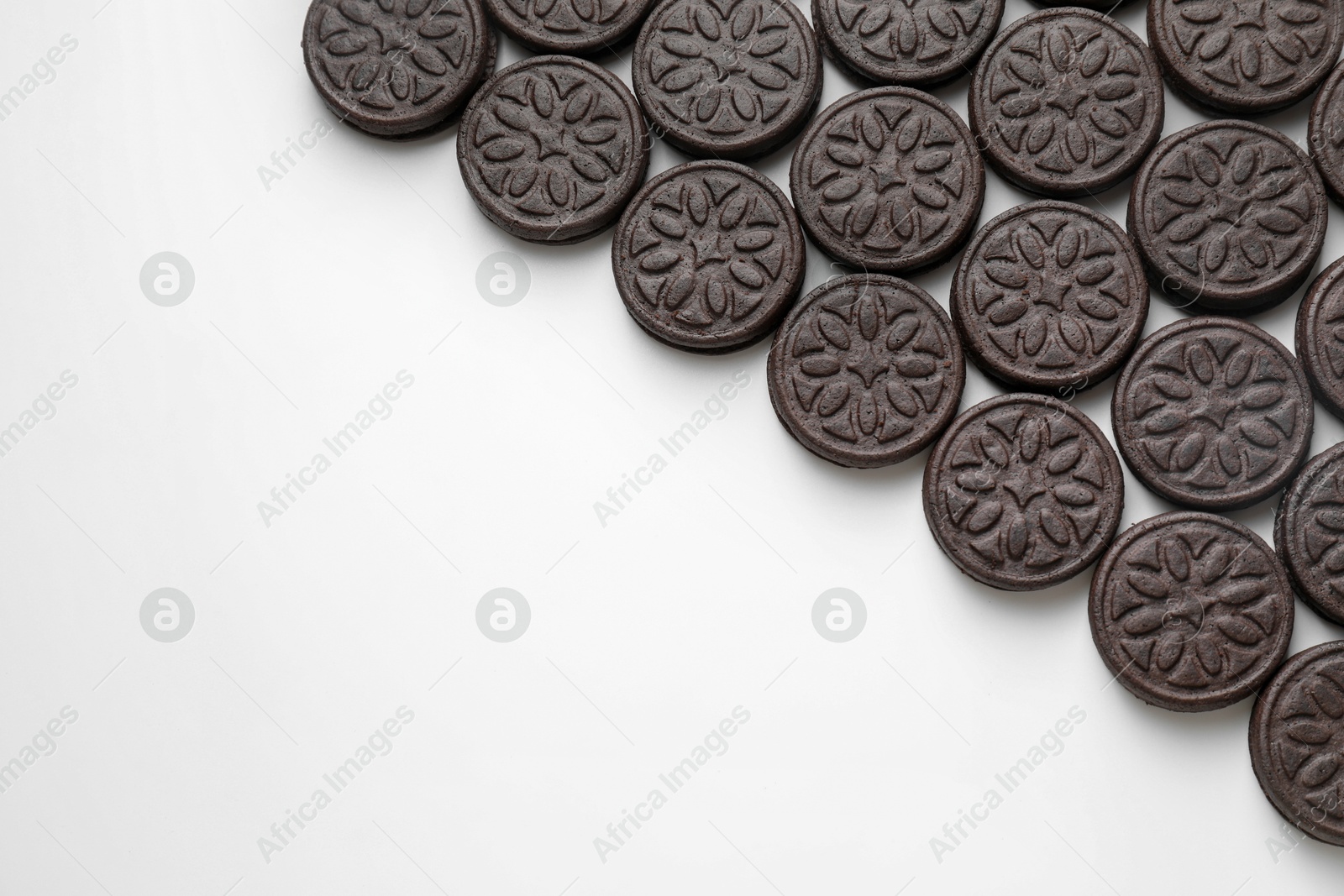 Photo of Tasty sandwich cookies on white background, top view. Space for text