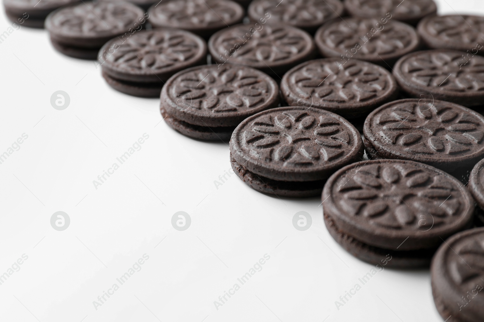 Photo of Tasty sandwich cookies on white background, space for text