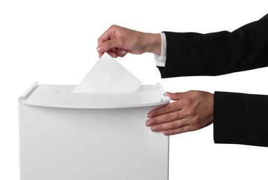 Photo of Woman putting her vote into ballot box against white background, closeup