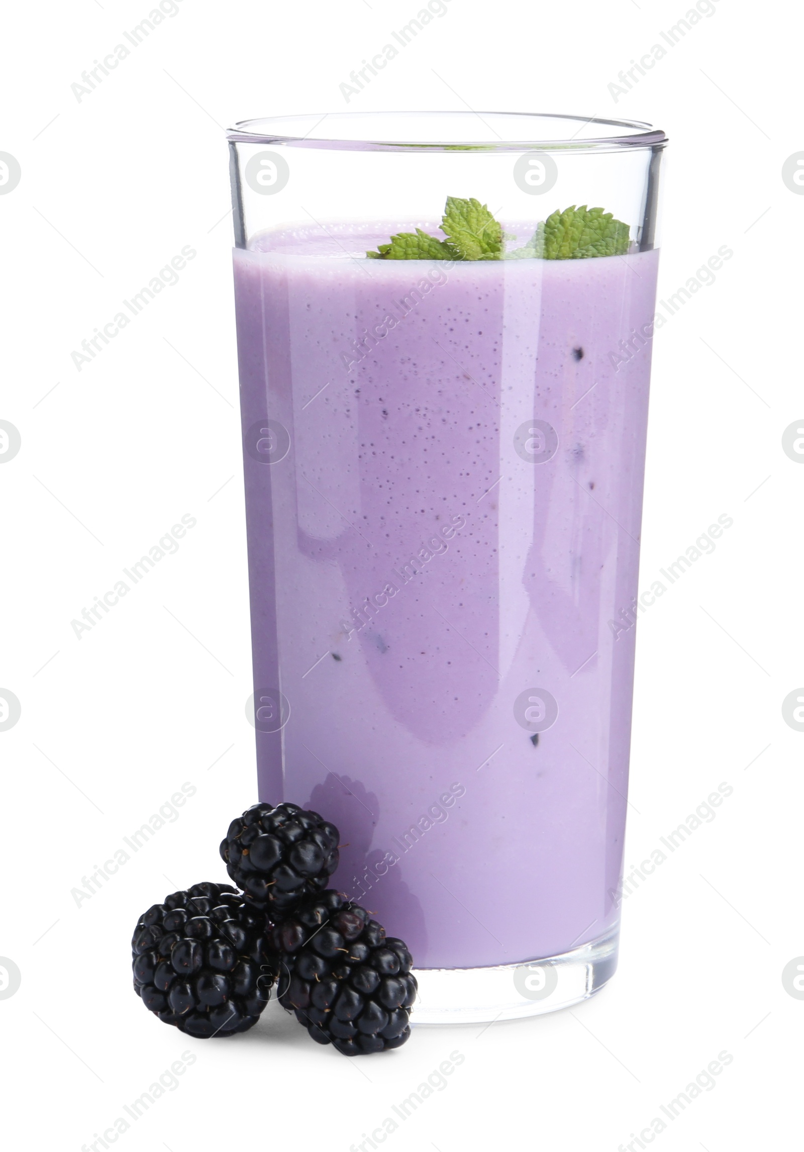 Photo of Tasty yogurt in glass and fresh blackberries isolated on white