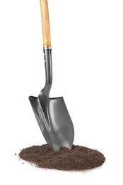 Photo of Metal shovel with wooden handle and pile of soil isolated on white