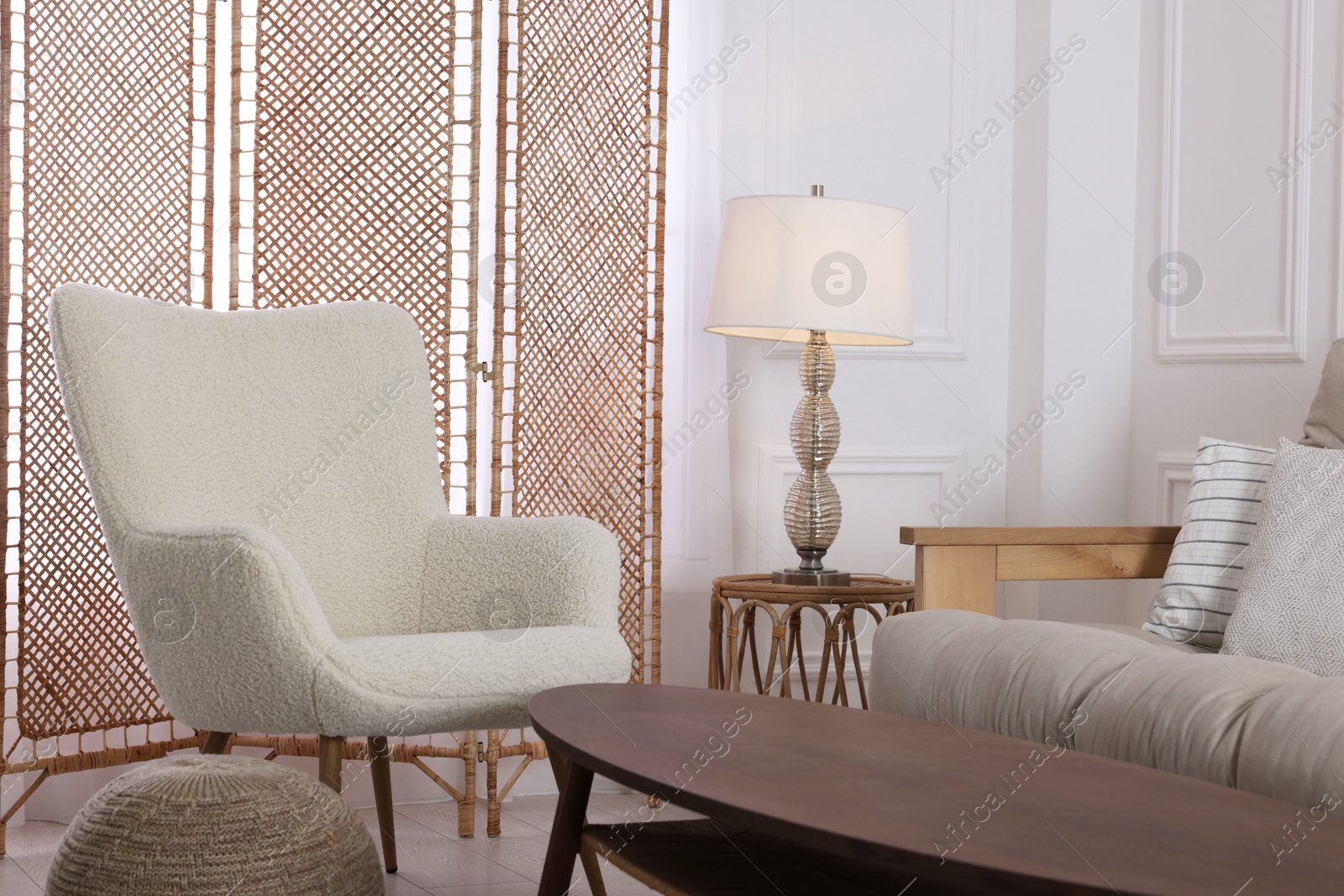 Photo of Folding screen, armchair, sofa and coffee table indoors