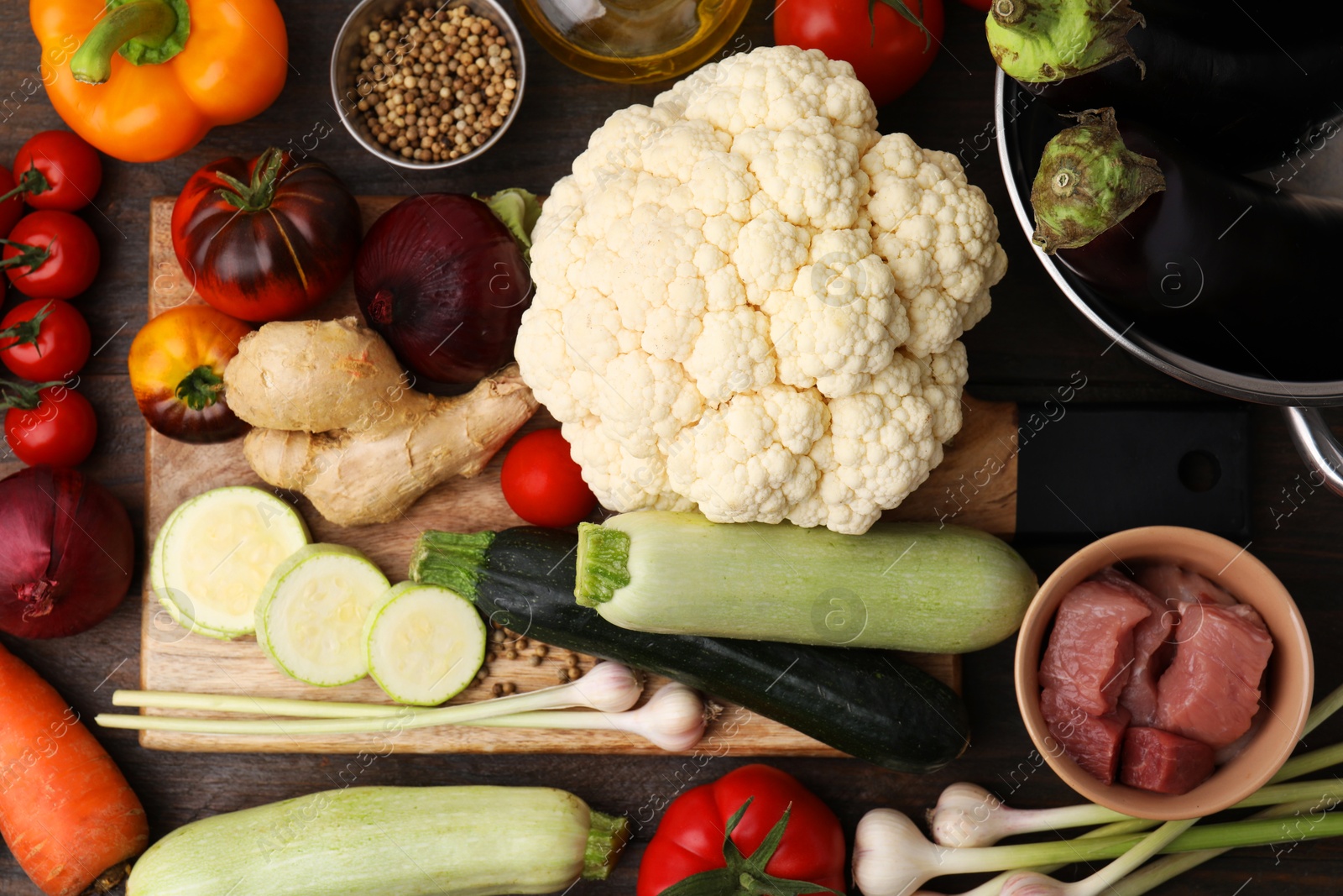 Photo of Different ingredients for stew on wooden table, top view