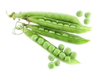 Photo of Green fresh peas and pods isolated on white, top view