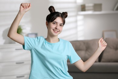 Photo of Portrait of smiling teenage girl at home