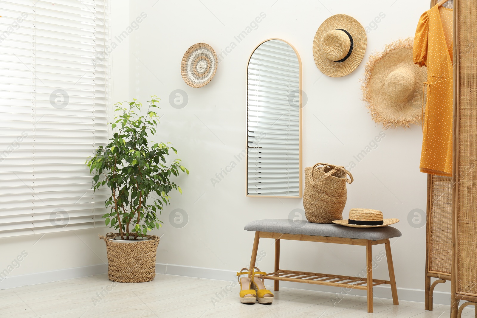 Photo of Mirror on white wall in room. Interior design