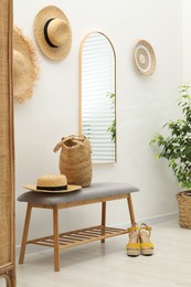 Photo of Mirror on white wall in room. Interior design